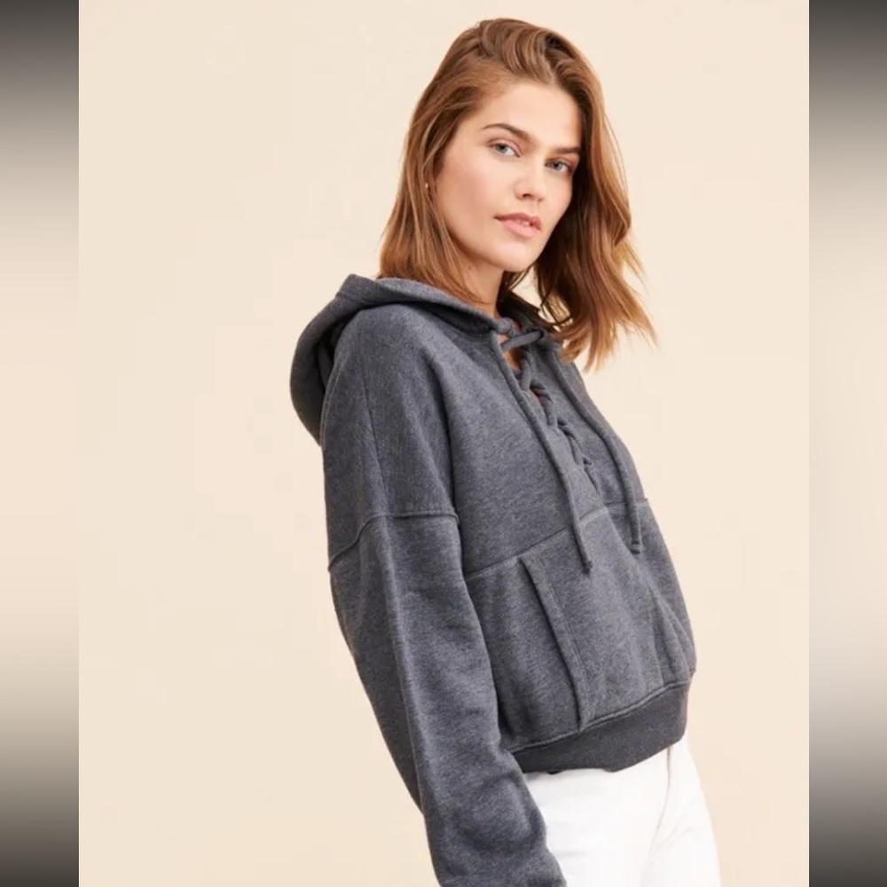 Free people movement lace up hoodie in gray. Size S.